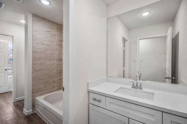 bathroom featuring vanity and wood-type flooring