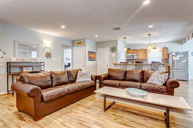 living room with light hardwood / wood-style floors