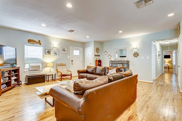 living room with light hardwood / wood-style flooring