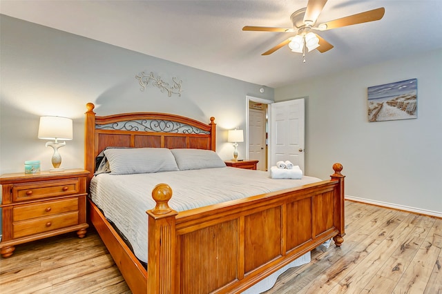 bedroom with ceiling fan and light hardwood / wood-style floors