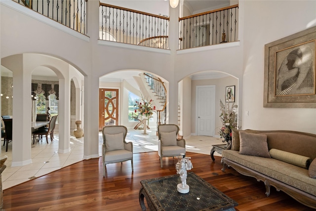 2710 Fort Caney Dr, Richmond, TX 77406 - living area featuring wood finished floors, a high ceiling, stairway, and baseboards