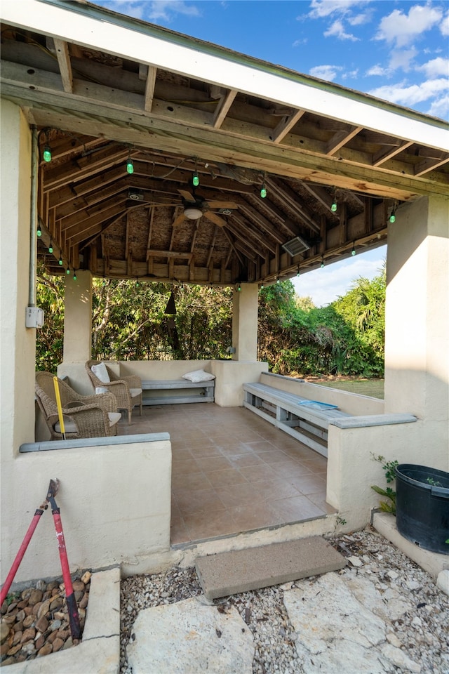 view of patio / terrace featuring a gazebo and ceiling fan