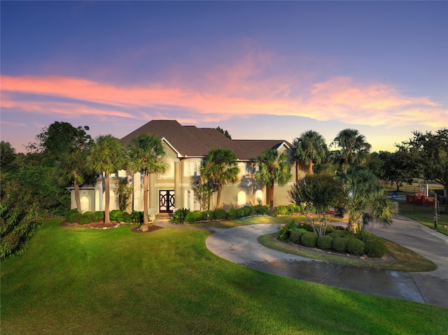 view of front of property with a lawn