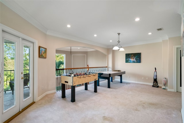 game room featuring ornamental molding and light colored carpet