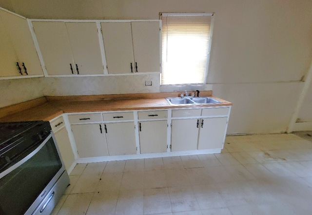 kitchen featuring stainless steel range with gas cooktop and a sink