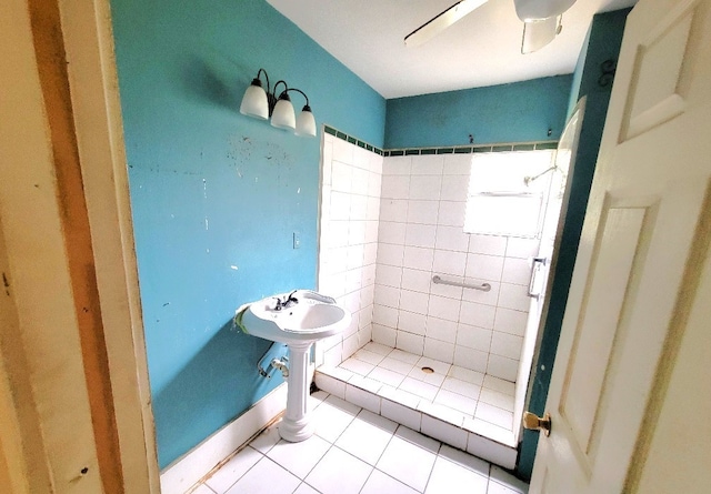 bathroom with a shower stall, a ceiling fan, and tile patterned floors