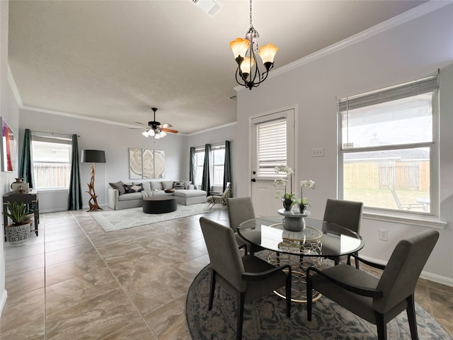 dining room featuring crown molding and ceiling fan with notable chandelier