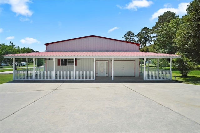 country-style home with a front yard and a carport