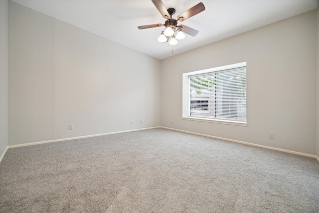 carpeted empty room with ceiling fan