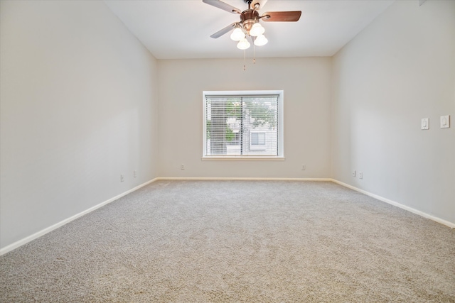 empty room with ceiling fan and carpet flooring