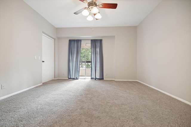 carpeted empty room with ceiling fan