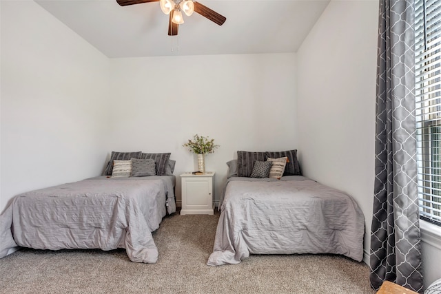 bedroom with carpet flooring, lofted ceiling, and ceiling fan