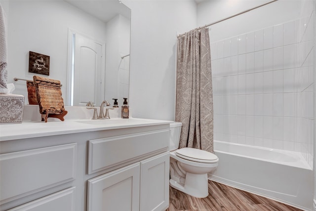 full bathroom featuring wood-type flooring, vanity, toilet, and shower / tub combo