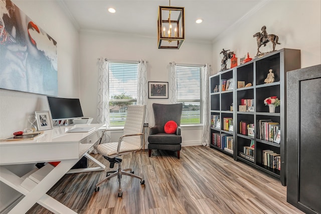 office with wood-type flooring, ornamental molding, and a chandelier