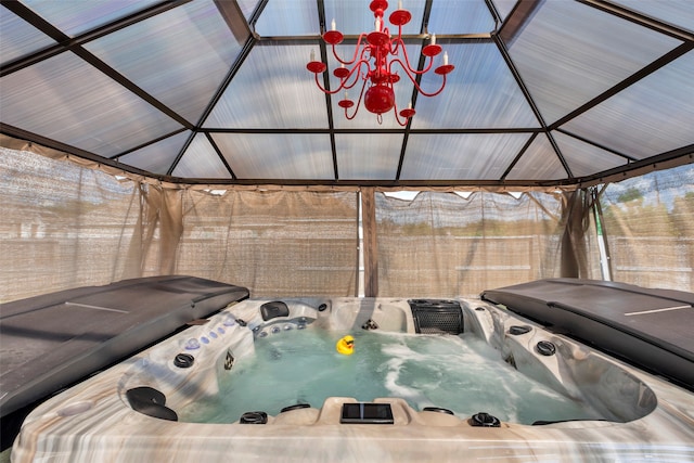 view of swimming pool featuring a gazebo and a hot tub