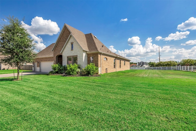 view of property exterior featuring a garage and a lawn