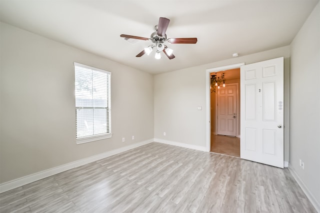 unfurnished bedroom with ceiling fan and light hardwood / wood-style floors