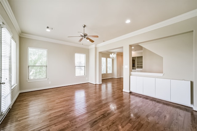 interior space featuring ceiling fan with notable chandelier, crown molding, and dark hardwood / wood-style flooring