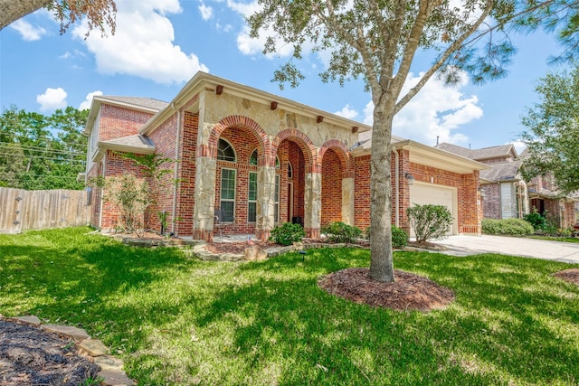 view of front of house with a garage and a front lawn