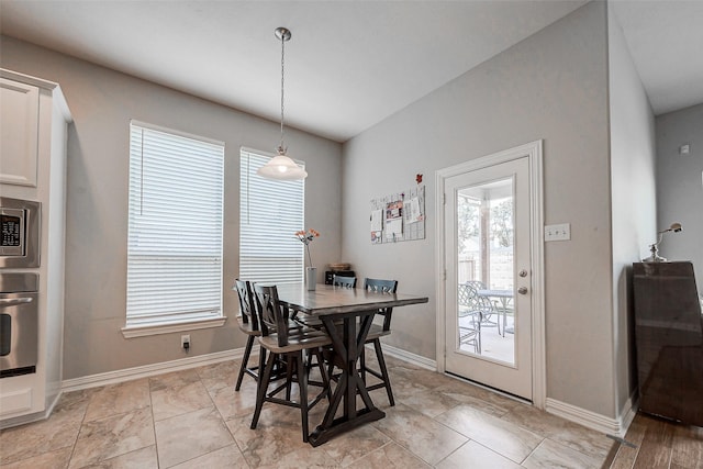 dining space featuring baseboards