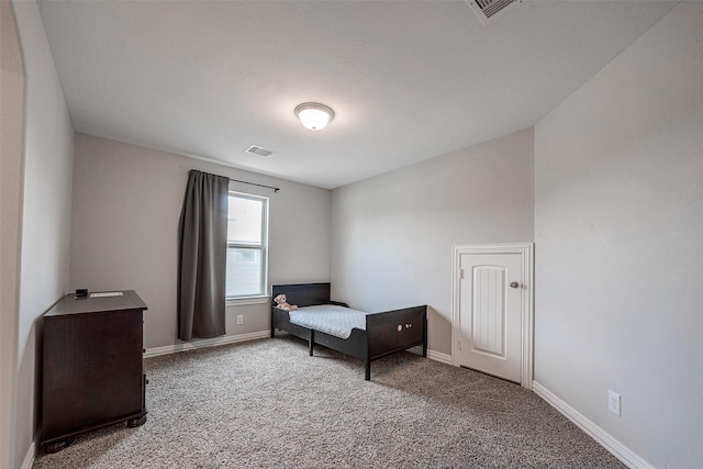 bedroom featuring carpet, visible vents, and baseboards