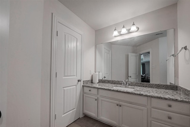 bathroom with visible vents and vanity