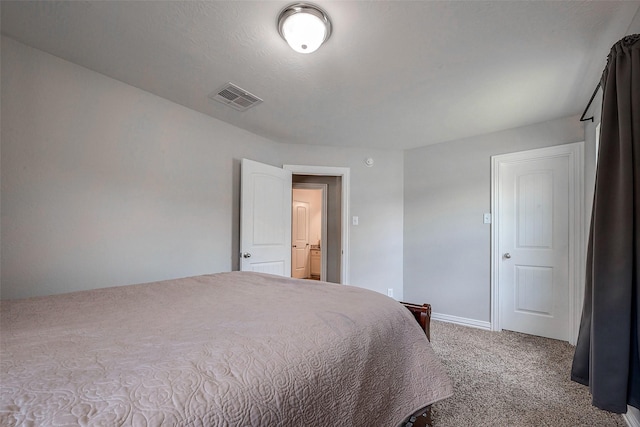 bedroom with visible vents, baseboards, and carpet flooring