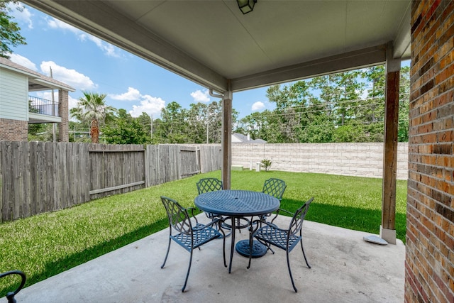 view of patio / terrace with outdoor dining area and a fenced backyard