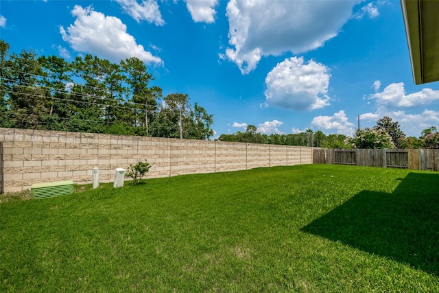 view of yard with a fenced backyard