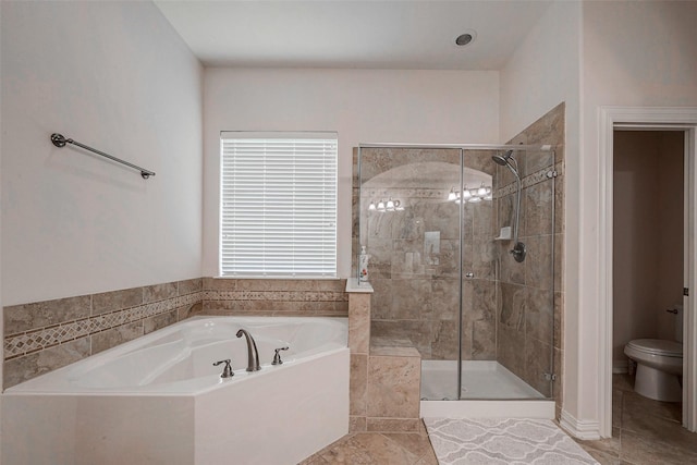 full bath with a shower stall, toilet, and a garden tub