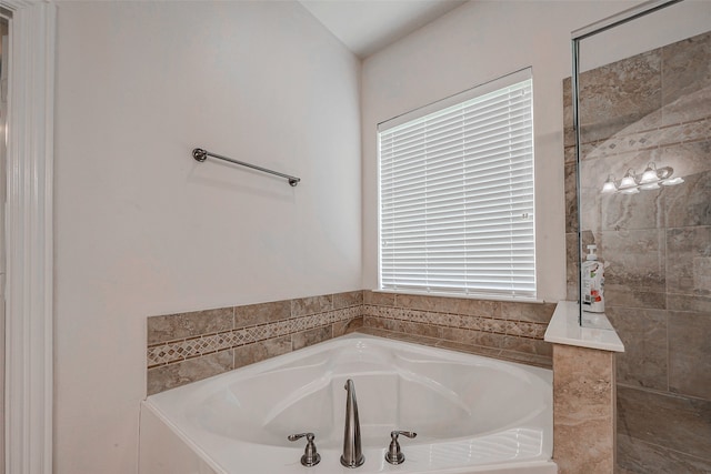 bathroom with tiled tub