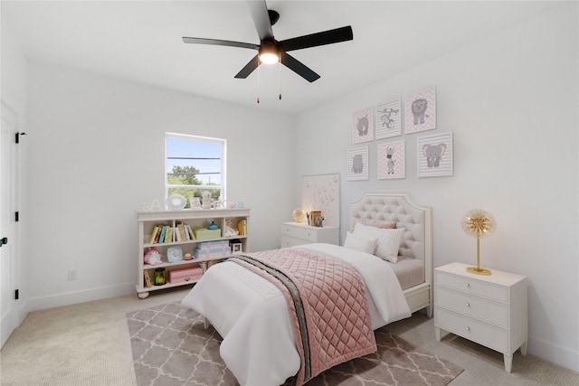 bedroom with ceiling fan and light colored carpet