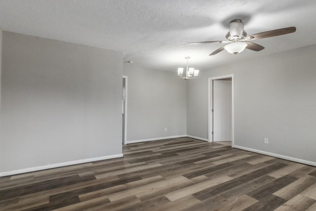 unfurnished room with dark hardwood / wood-style floors, ceiling fan with notable chandelier, and a textured ceiling