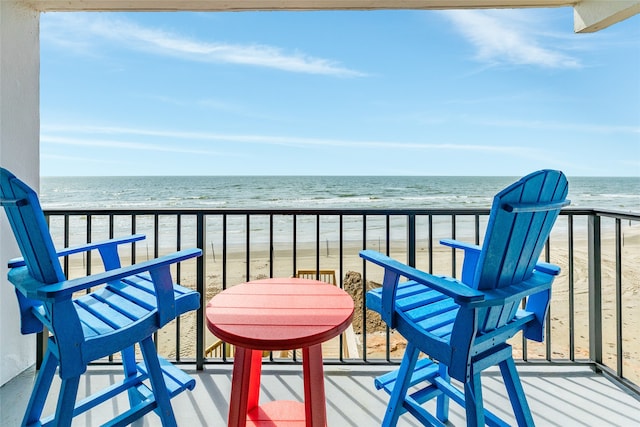 balcony with a view of the beach and a water view