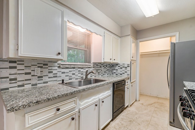 kitchen with white cabinetry, stainless steel range oven, dishwasher, sink, and decorative backsplash