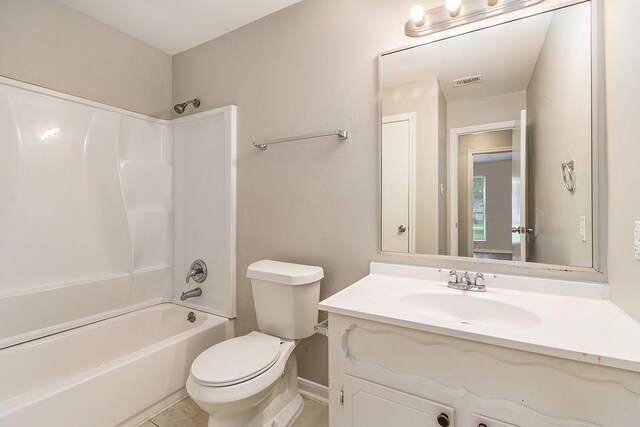 full bathroom featuring tile patterned flooring, vanity, toilet, and shower / tub combination