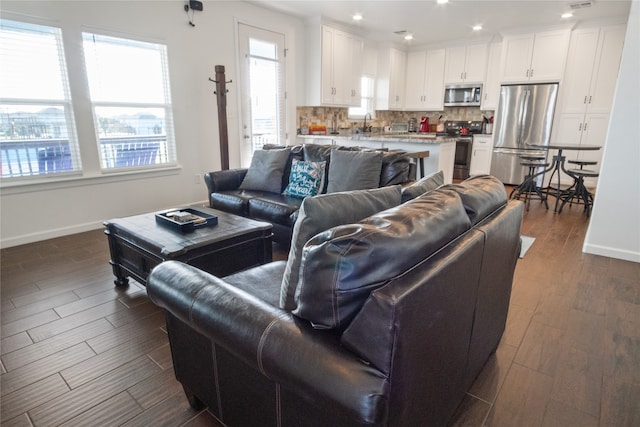 living room featuring dark wood-type flooring