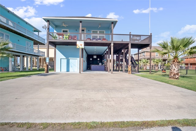 exterior space featuring a yard, a garage, and a balcony