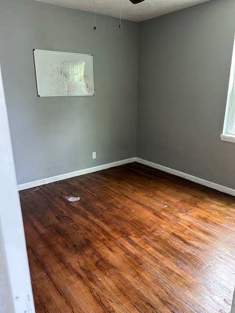 spare room featuring ceiling fan and wood-type flooring