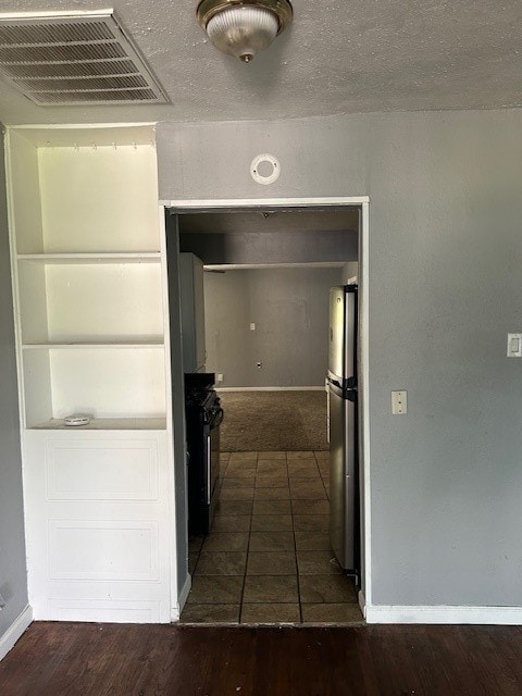 hallway featuring dark hardwood / wood-style floors