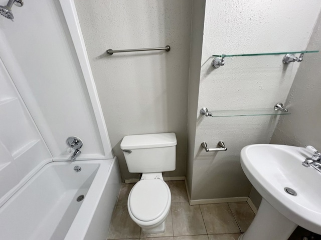 full bathroom with shower / washtub combination, tile patterned flooring, toilet, and sink