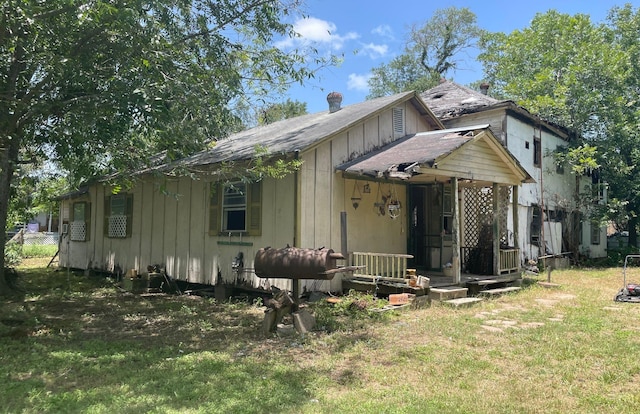 bungalow-style home with a front yard