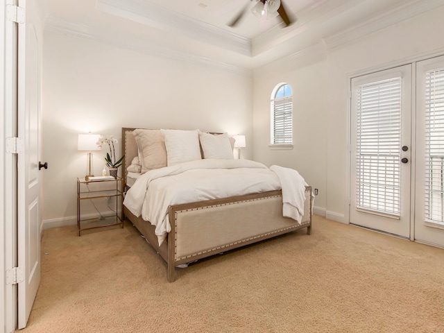 bedroom with crown molding, multiple windows, access to exterior, ceiling fan, and light colored carpet