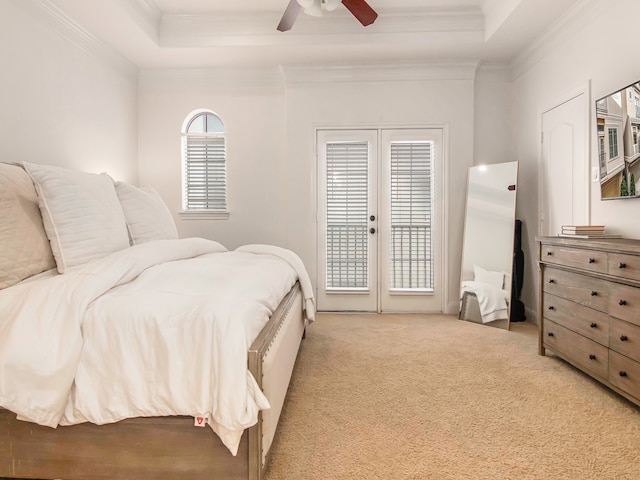 bedroom with light carpet, ceiling fan, crown molding, and access to outside