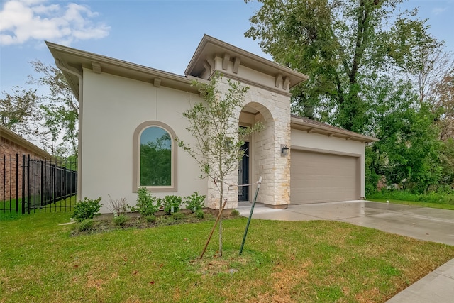 view of front facade with a front yard and a garage