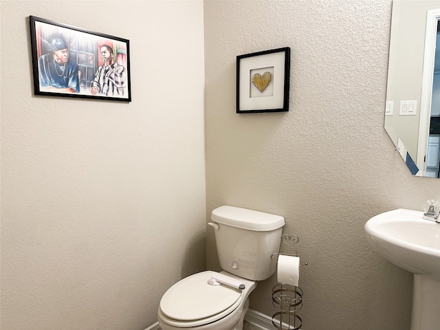 bathroom featuring toilet