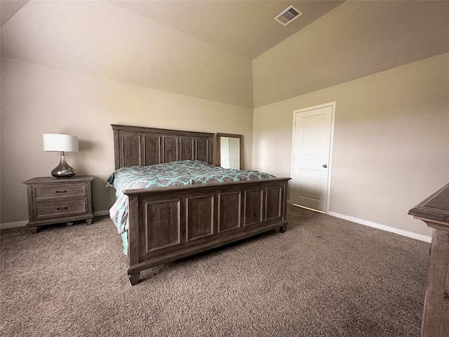 carpeted bedroom with lofted ceiling