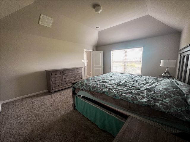 carpeted bedroom with lofted ceiling