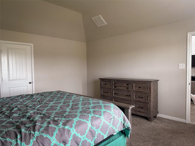 bedroom featuring carpet flooring and vaulted ceiling