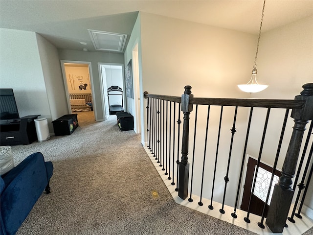 corridor featuring carpet and vaulted ceiling